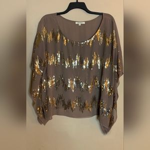 Umgee Sheer Angelwing blouse with sequined detailing.